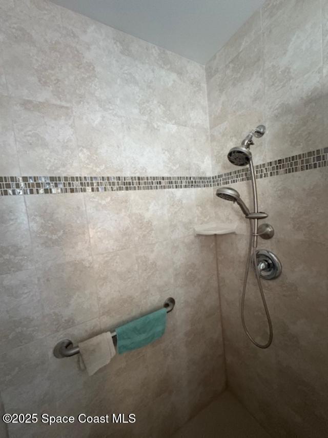 995 Botany Lane Rockledge, FL 32955 - Photo 42 of 44 a bathroom with a shower