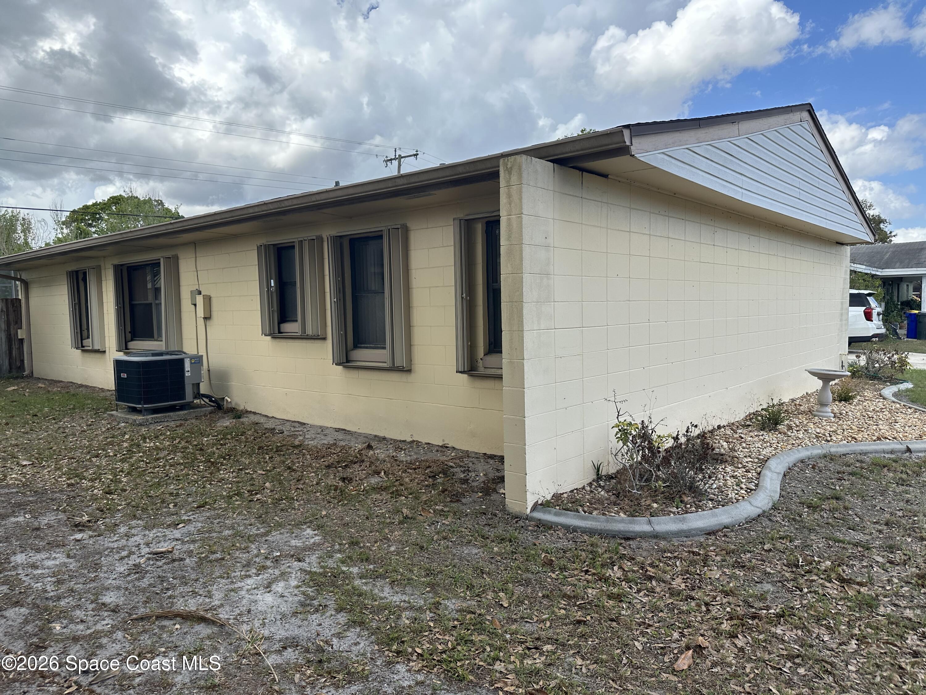 995 Botany Lane Rockledge, FL 32955 - Photo 45 of 64 a view of a house with a yard