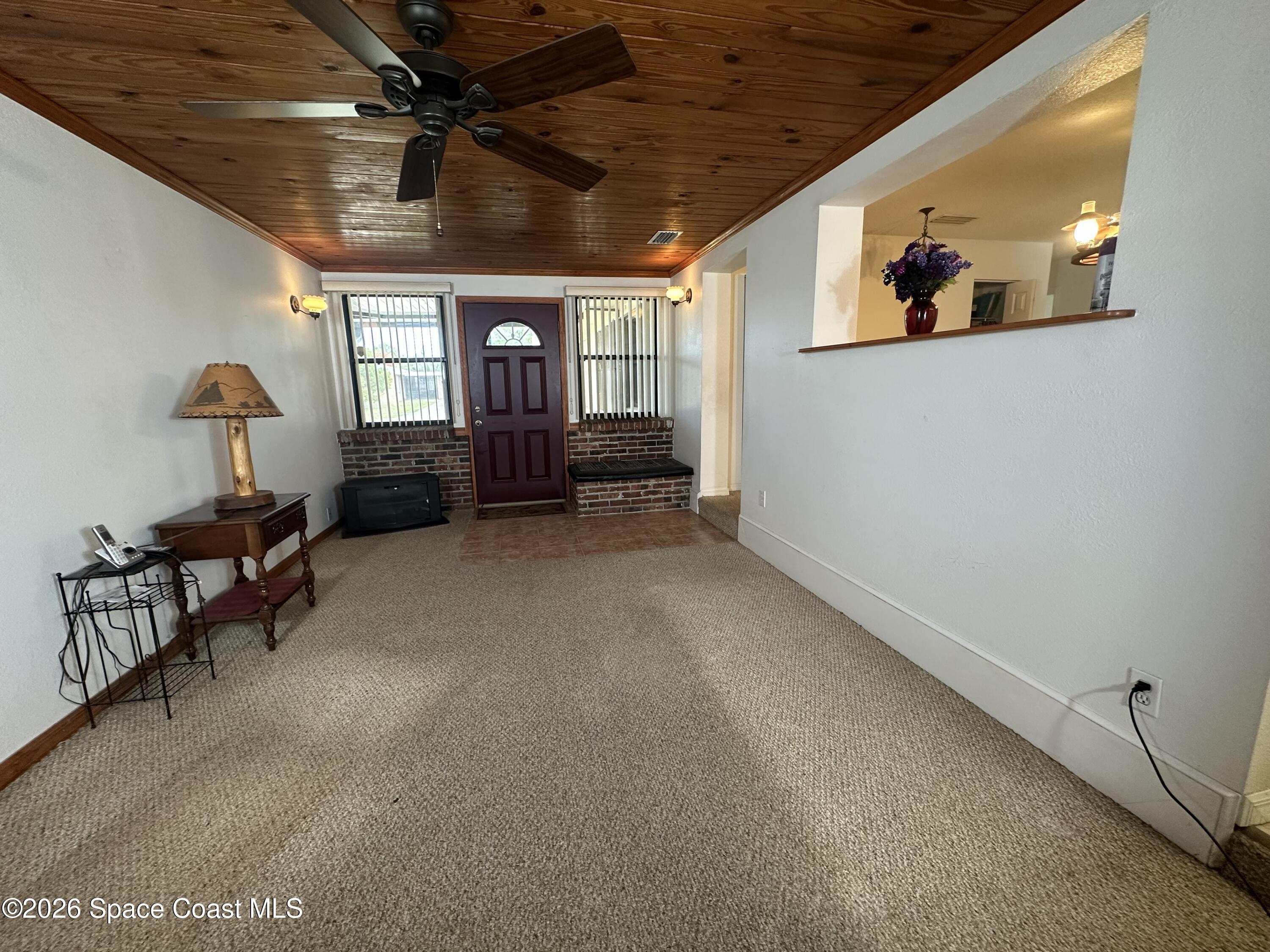995 Botany Lane Rockledge, FL 32955 - Photo 48 of 64 a view of a livingroom with furniture and a window