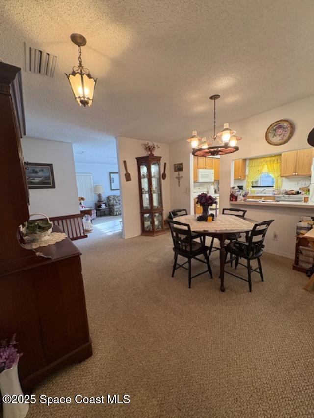 995 Botany Lane Rockledge, FL 32955 - Photo 9 of 64 a view of a dining room with furniture and chandelier