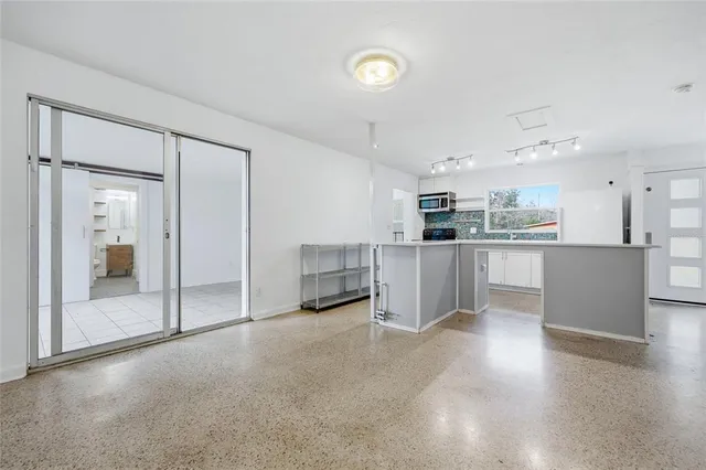 a view of a kitchen with a sink and cabinets