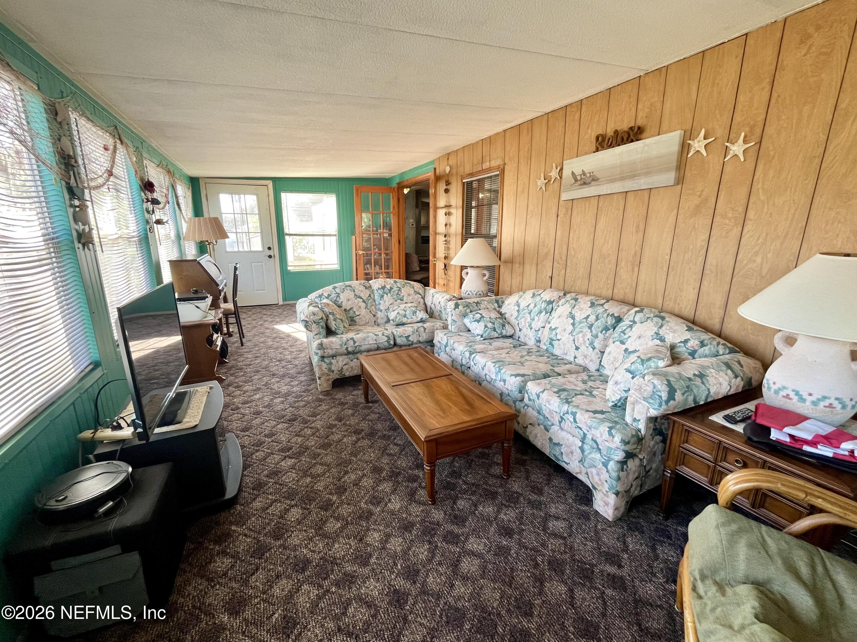 174 Buchanan Circle Satsuma, FL 32189 - Photo 5 of 16 a living room with furniture and a window