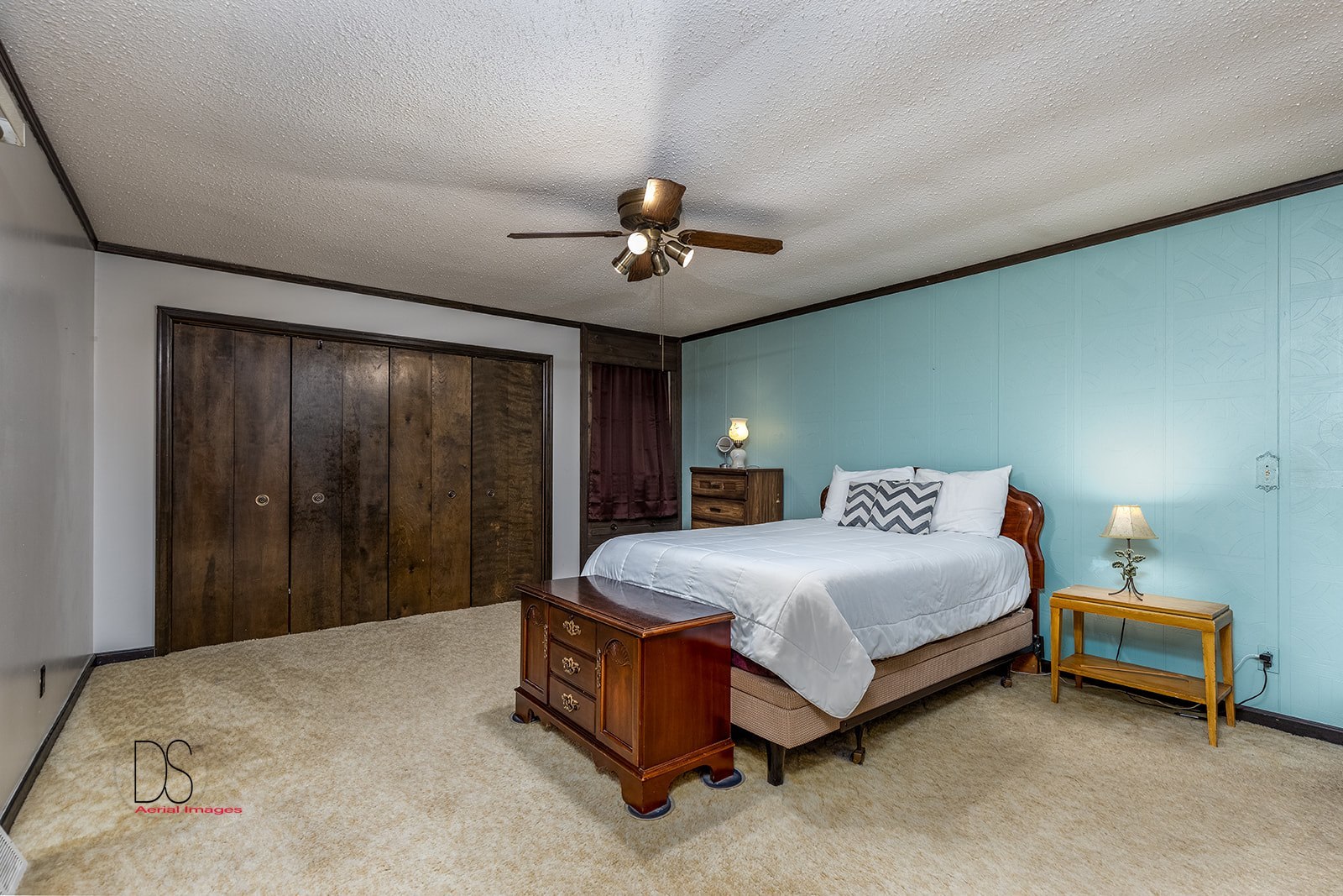 2863 East 2575th Road Marseilles, IL 61341 - Photo 29 of 37 a spacious bedroom with a bed and a chandelier