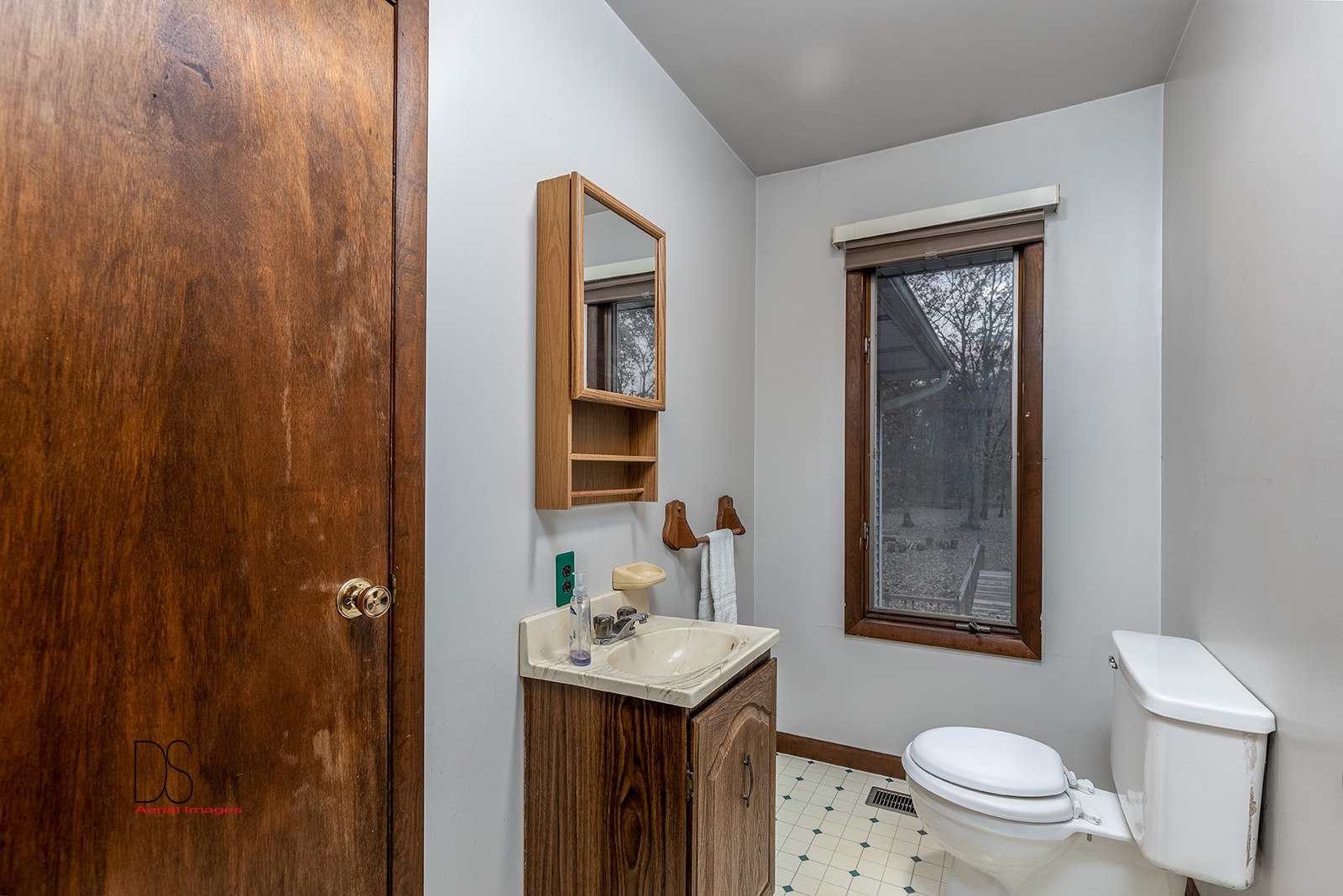 2863 East 2575th Road Marseilles, IL 61341 - Photo 30 of 37 a bathroom with a sink a toilet and shower curtain