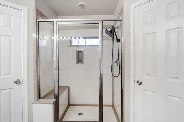a bathroom with a sink double vanity and a mirror