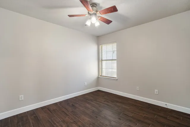 a view of a house with wooden floor and a window