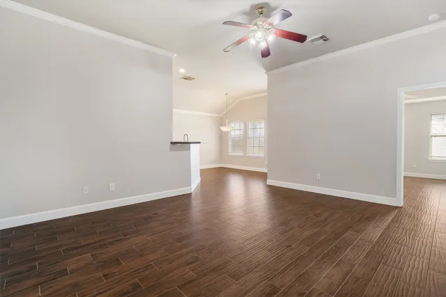 a view of a livingroom with wooden floor
