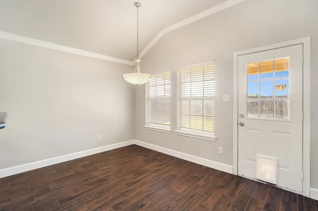 a kitchen with stainless steel appliances granite countertop a stove and a microwave