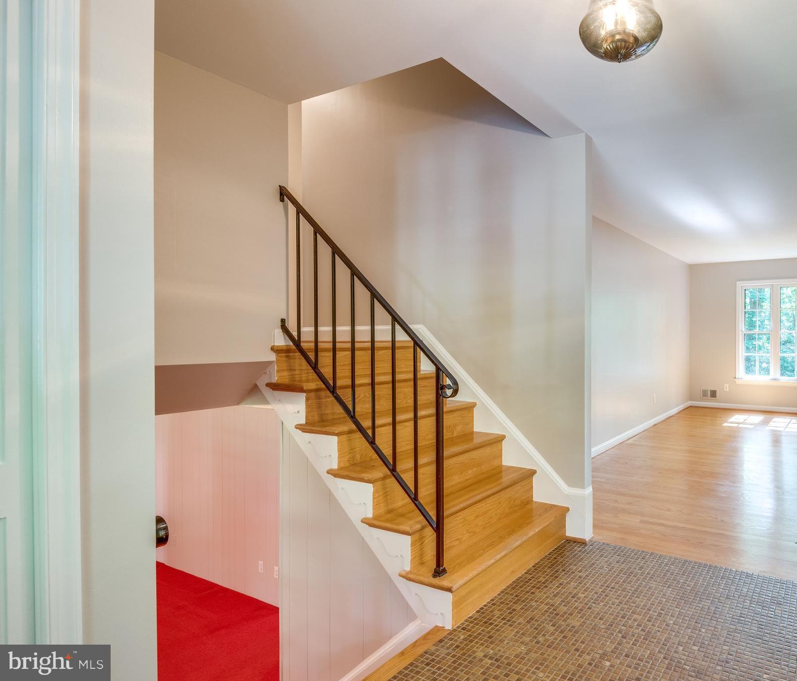2402 Black Cap Lane Reston, VA 20191 - Photo 13 of 30 Entry foyer with tile flooring steps to bedrooms