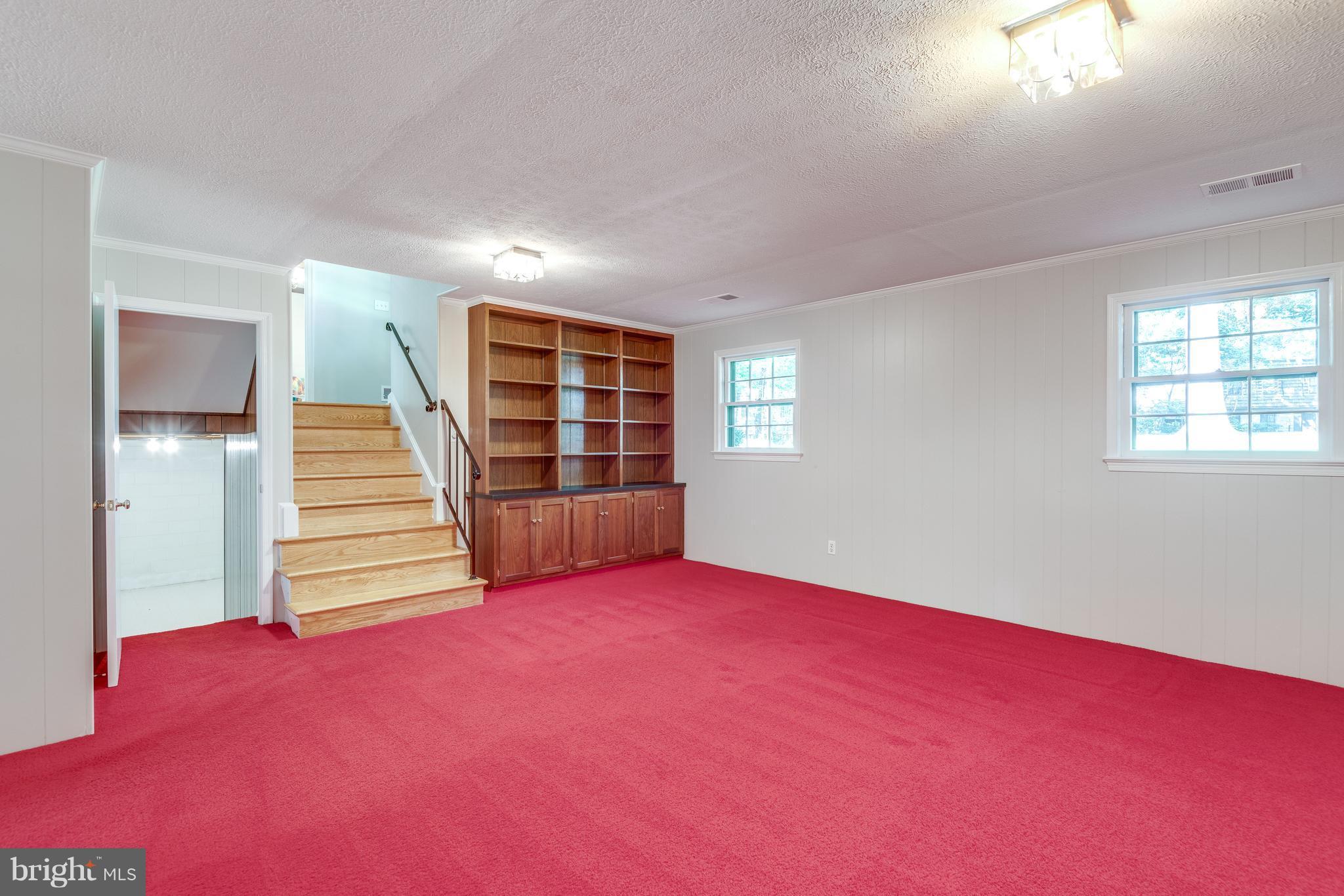 2402 Black Cap Lane Reston, VA 20191 - Photo 19 of 30 Family Rm w/built in shelving & wood fireplace