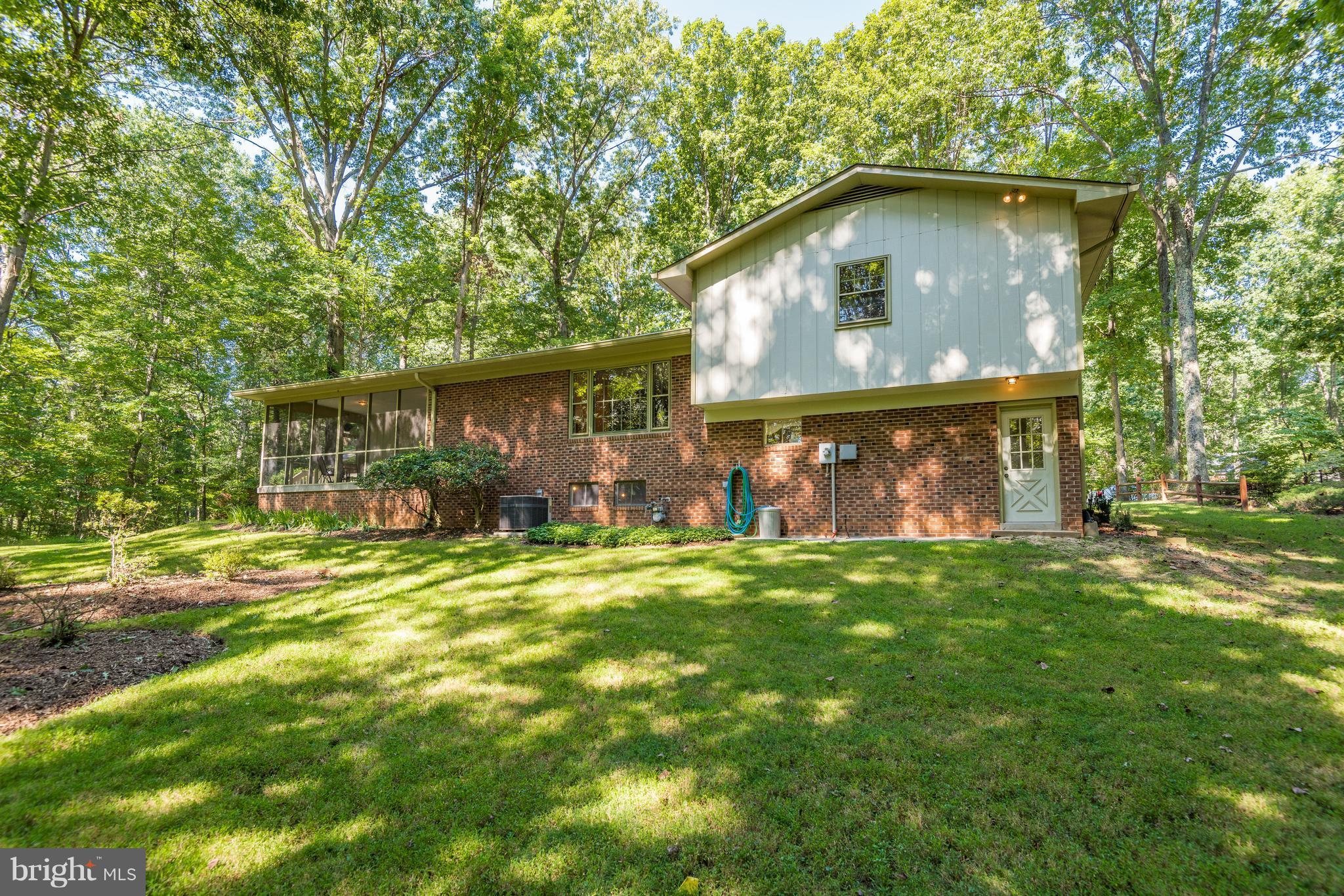 2402 Black Cap Lane Reston, VA 20191 - Photo 27 of 30 View from back yard on level private wooded lot