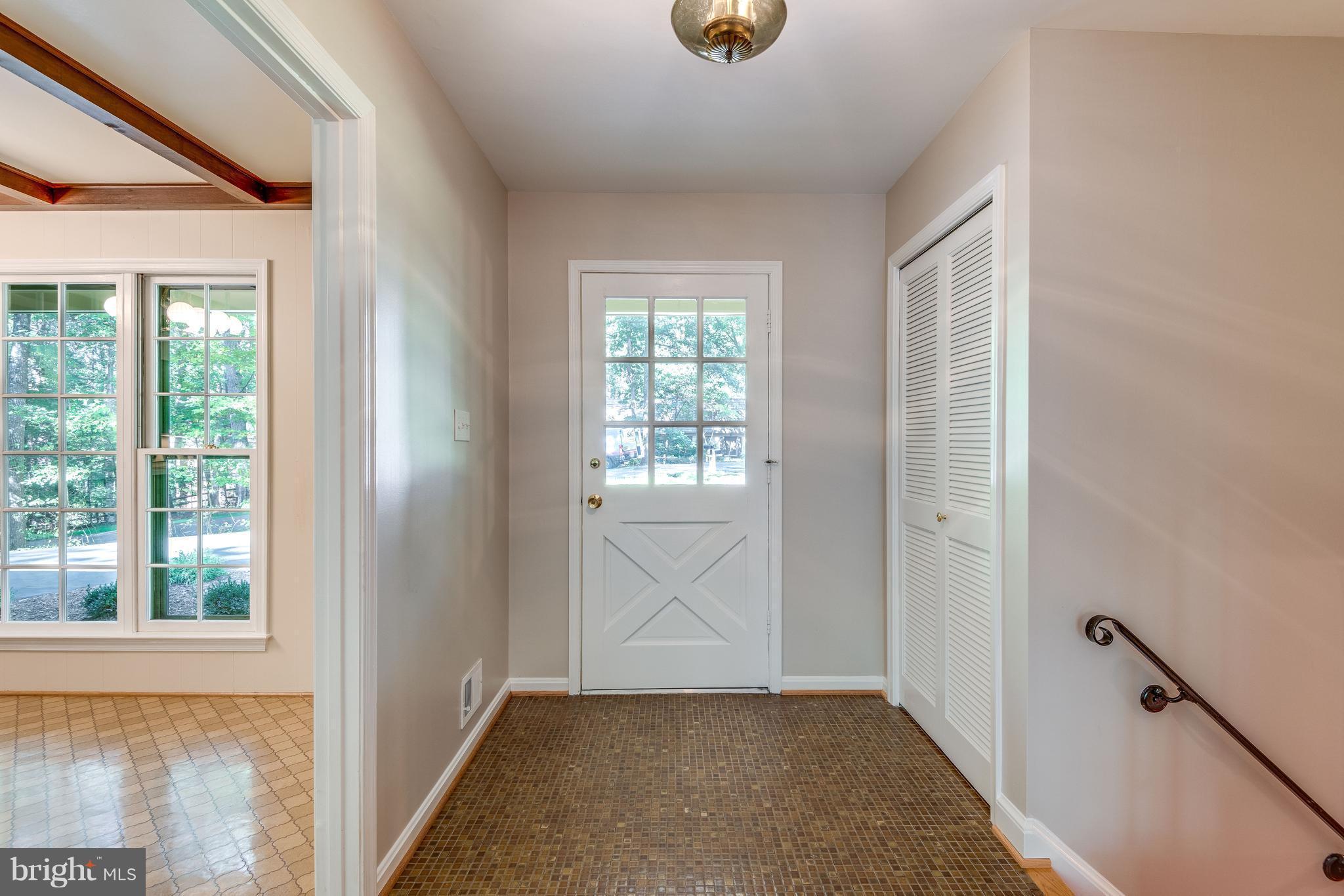 2402 Black Cap Lane Reston, VA 20191 - Photo 4 of 30 Entry Hallway kitchen to left & rec rm right