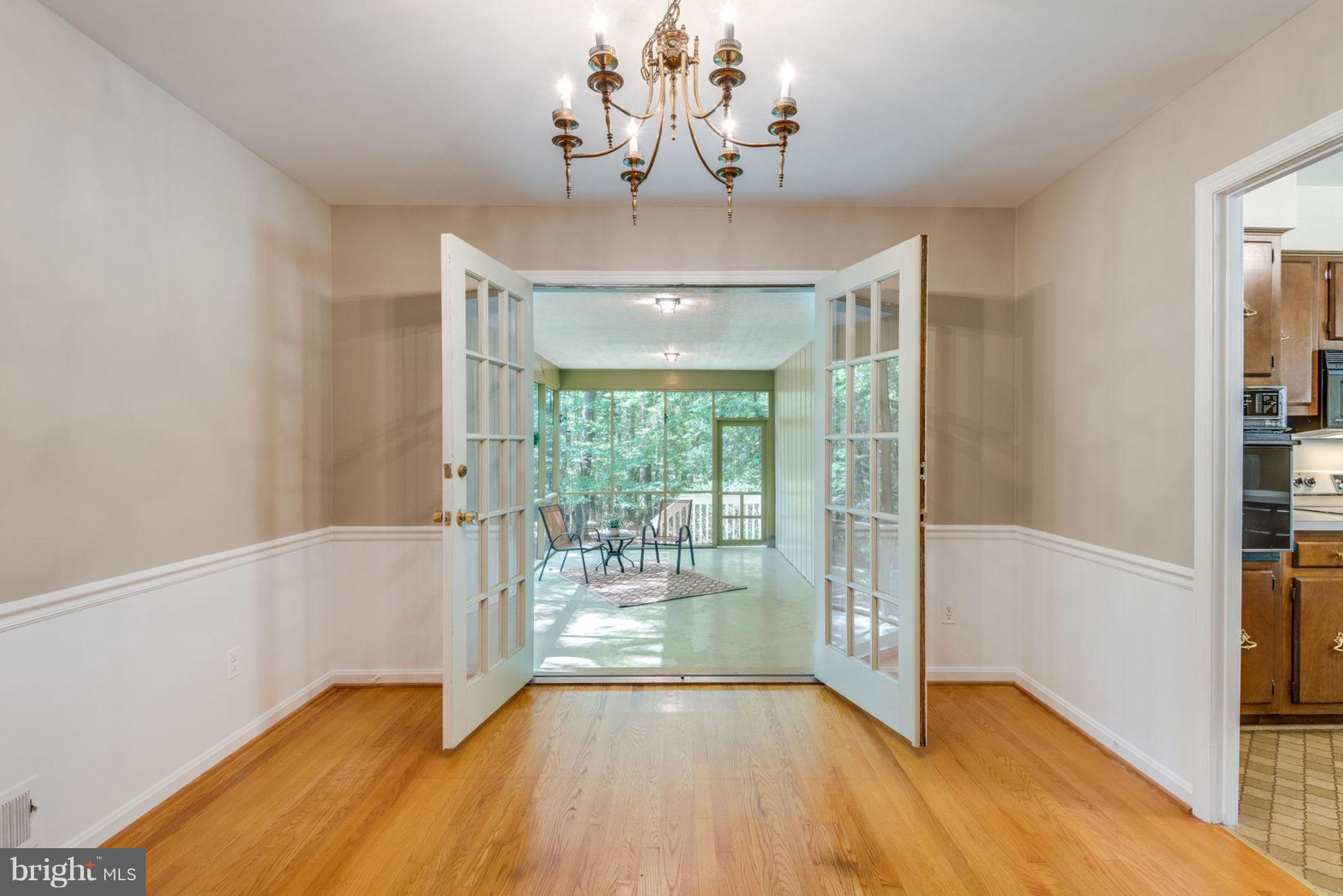 2402 Black Cap Lane Reston, VA 20191 - Photo 6 of 30 View from Dining Room French Doors to Screen Porch
