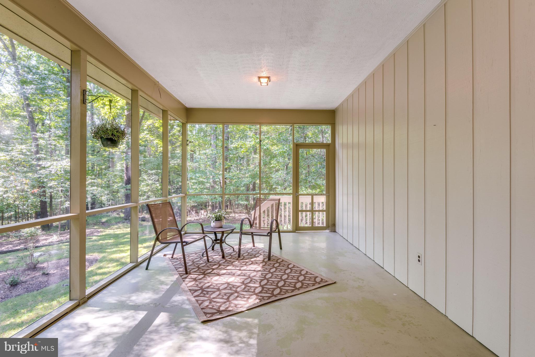 2402 Black Cap Lane Reston, VA 20191 - Photo 7 of 30 Screen Porch with door out to half acre plus yard