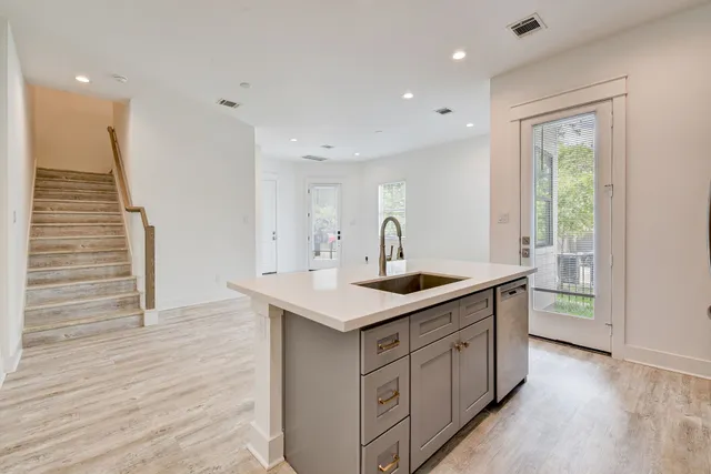 a kitchen with a sink and cabinets