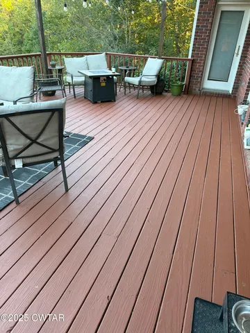 a terrace view with sitting space and seating space