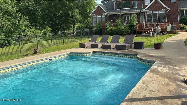 a view of a house with a yard patio and sitting area