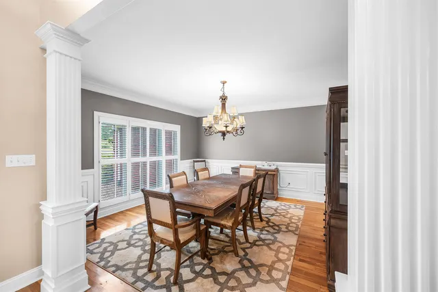 a view of a dining room with furniture and window