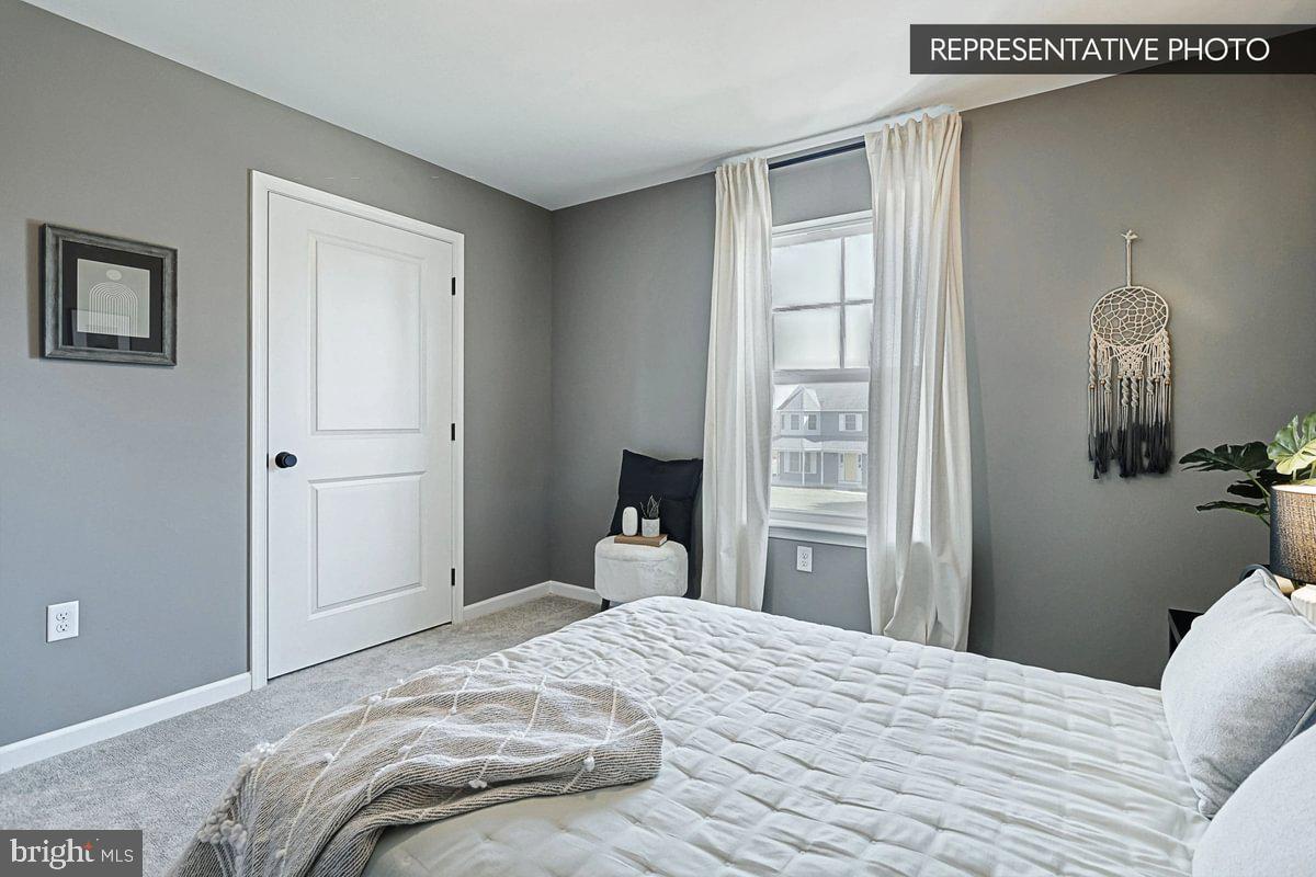 6316 Liam Drive Spring Grove, PA 17362 - Photo 14 of 20 a bedroom with a bed and a mirror