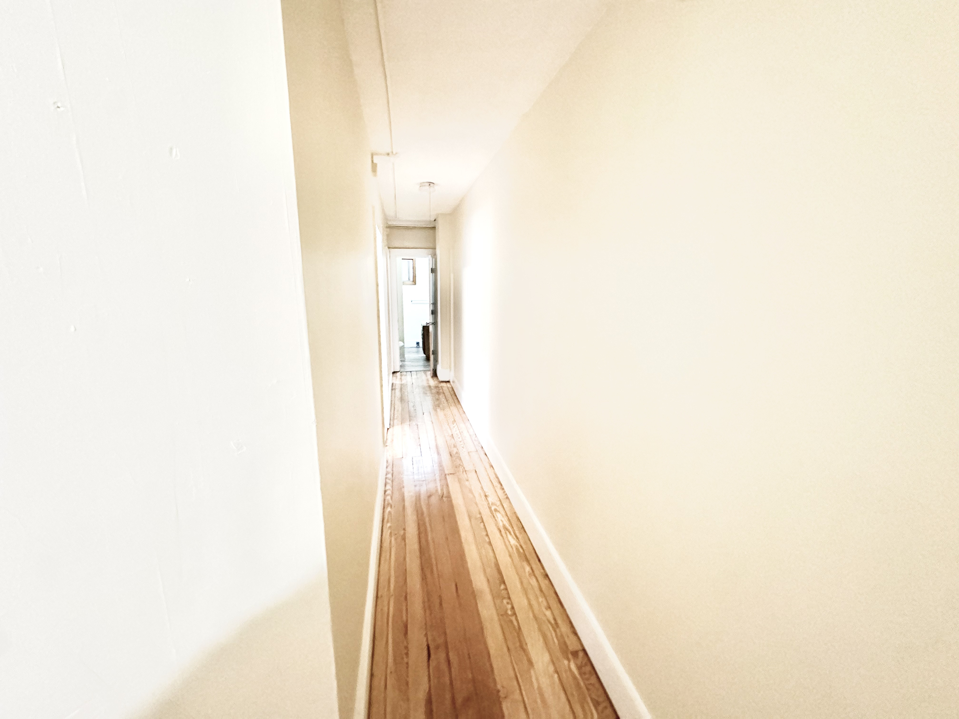 1019 West Main Street, Unit 3L Waterbury, CT 06708 - Photo 12 of 29 a view of a room with wooden floor