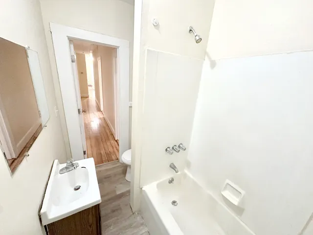 a view of an empty room with a window