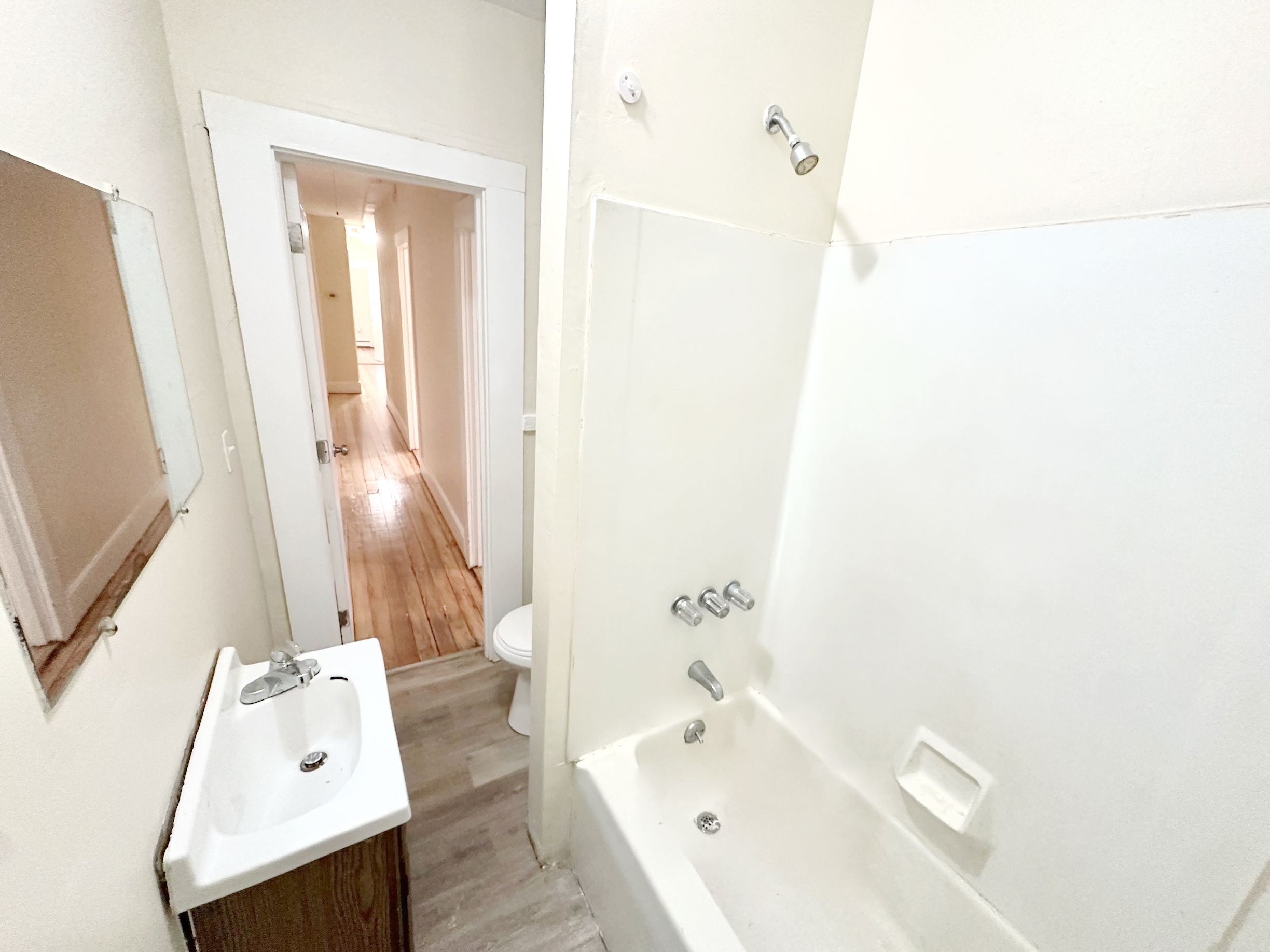 1019 West Main Street, Unit 3L Waterbury, CT 06708 - Photo 24 of 29 a bathroom with a tub sink and mirror