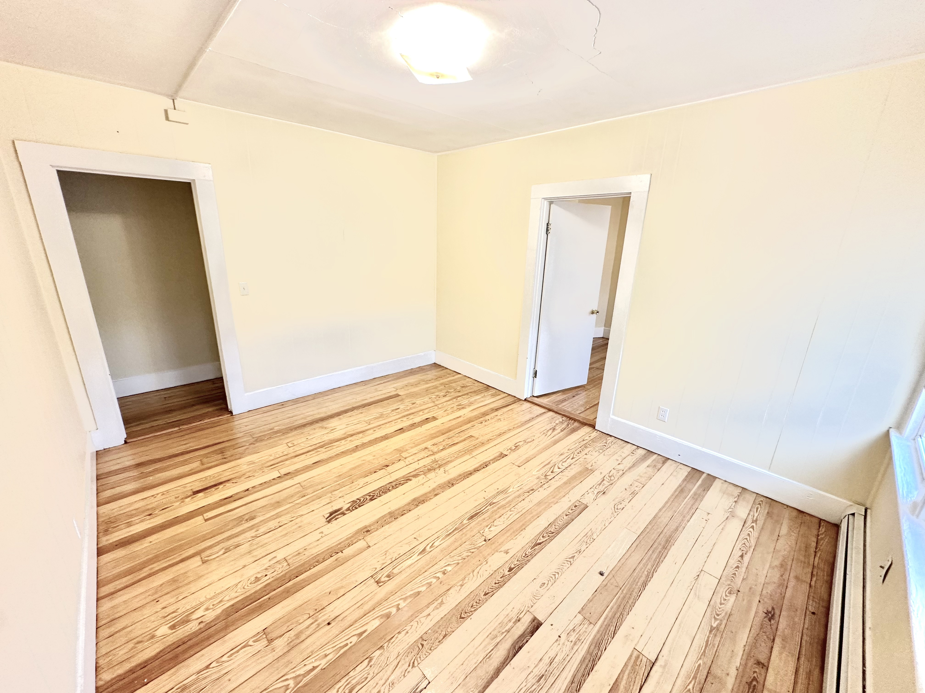 1019 West Main Street, Unit 3L Waterbury, CT 06708 - Photo 5 of 29 a view of empty room with wooden floor