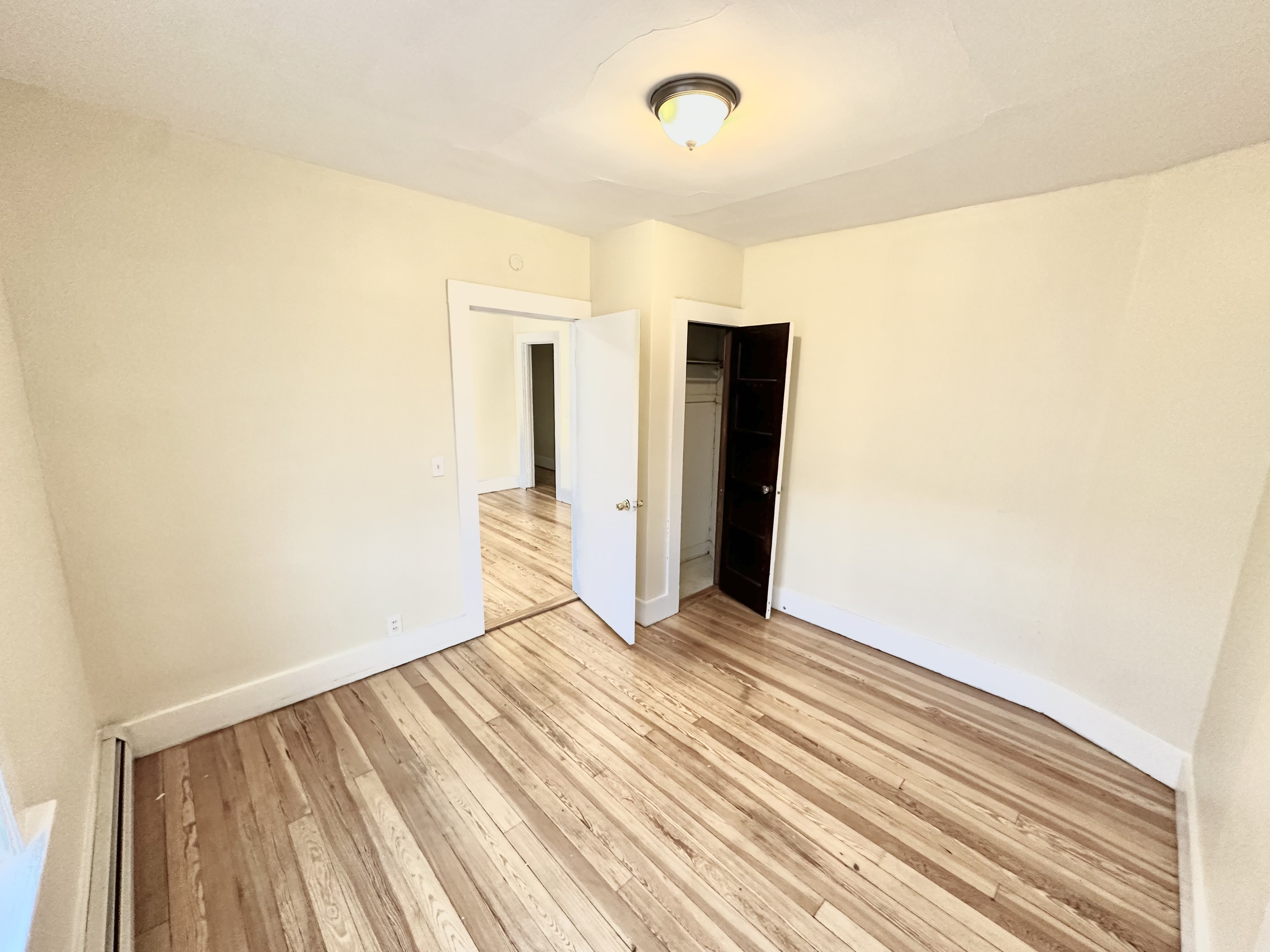 1019 West Main Street, Unit 3L Waterbury, CT 06708 - Photo 10 of 29 a view of a room with wooden floor