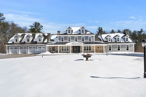 a front view of a house with a ocean view
