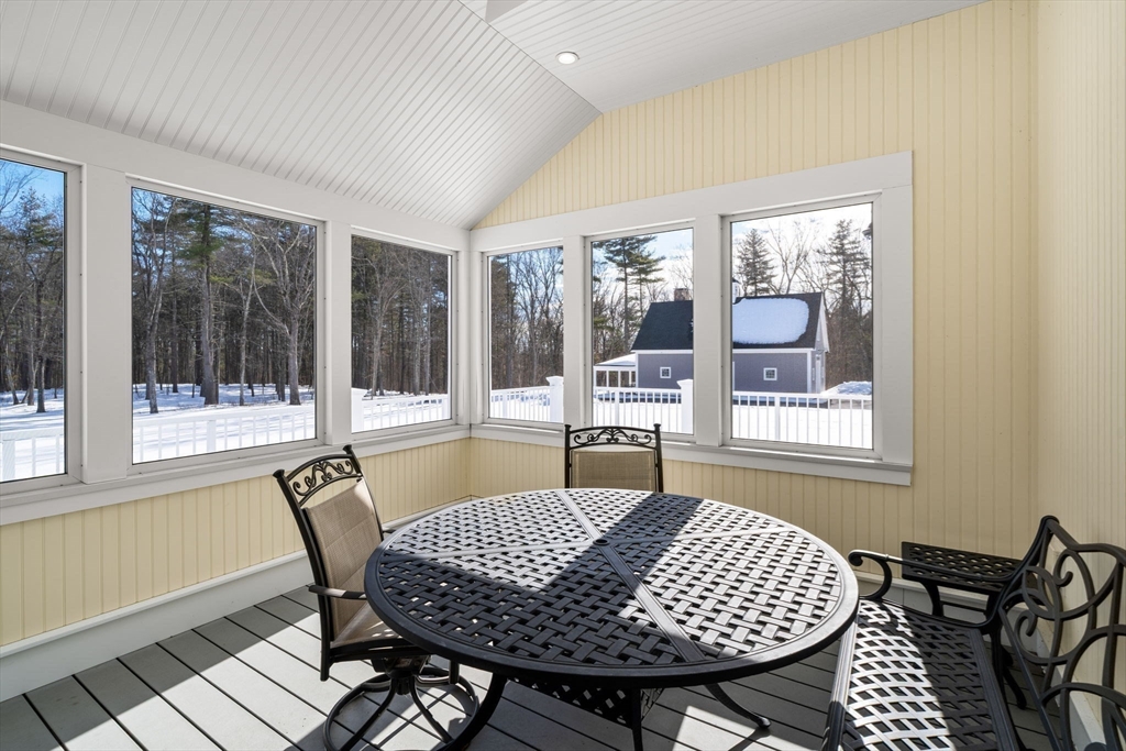 72 Dale Lane Groton, MA 01450 - Photo 13 of 42 a view of a dining room with furniture wooden floor and a rug
