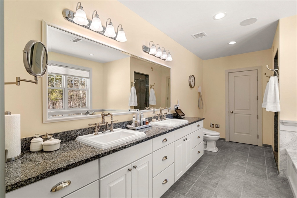 72 Dale Lane Groton, MA 01450 - Photo 20 of 42 a spacious bathroom with double sink and a mirror