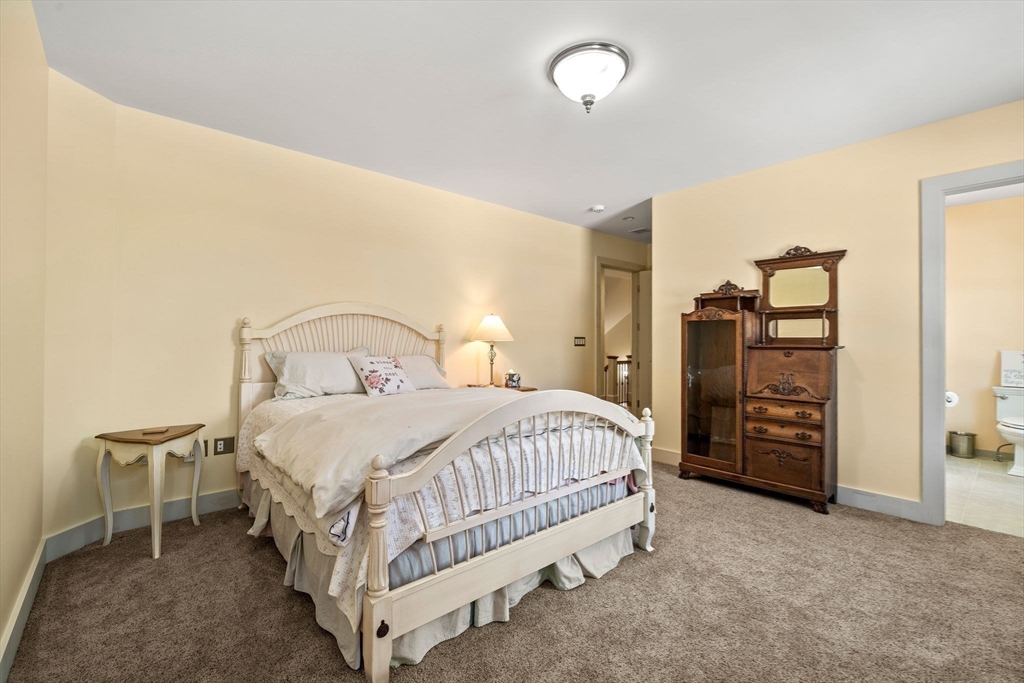 72 Dale Lane Groton, MA 01450 - Photo 23 of 42 a bedroom with a bed and walk in closet