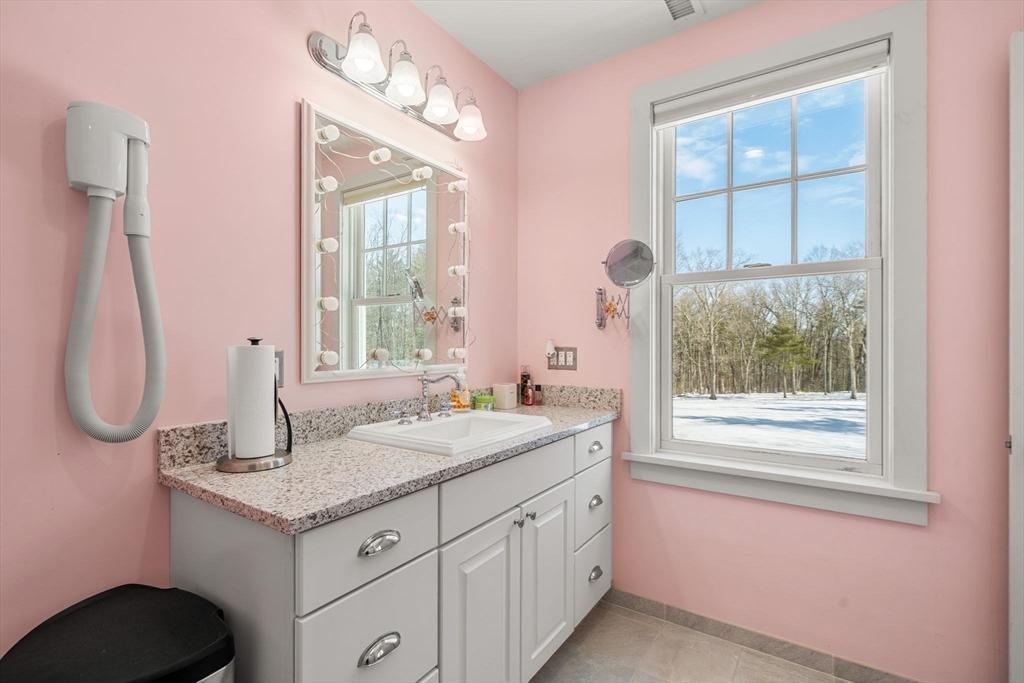 72 Dale Lane Groton, MA 01450 - Photo 26 of 42 a bathroom with a granite countertop sink and a window