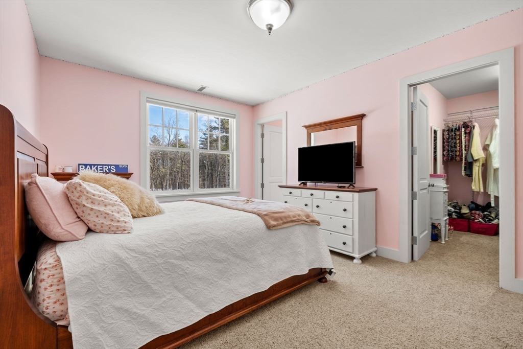 72 Dale Lane Groton, MA 01450 - Photo 27 of 42 a bedroom with bed tv and window