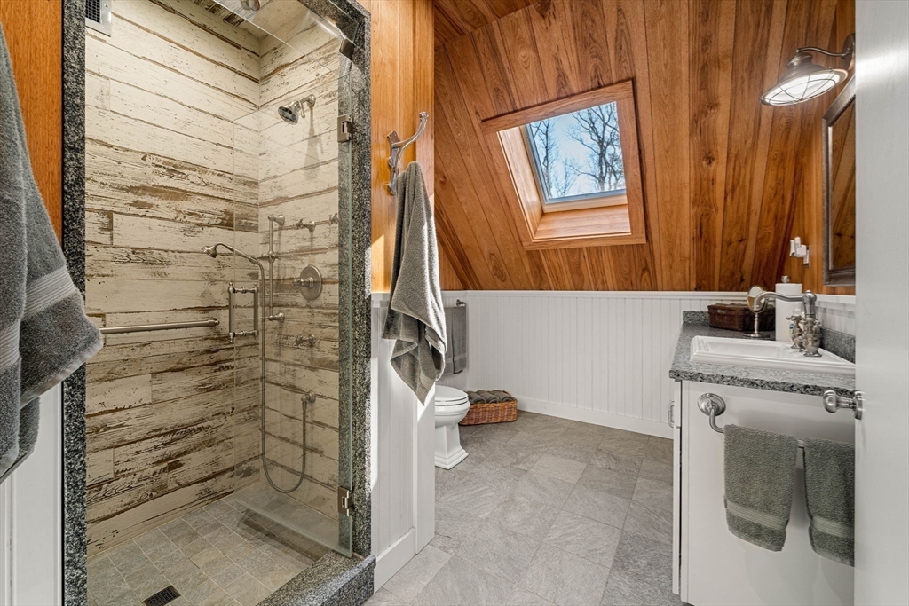 72 Dale Lane Groton, MA 01450 - Photo 40 of 42 a bathroom with a granite countertop shower a sink and a toilet