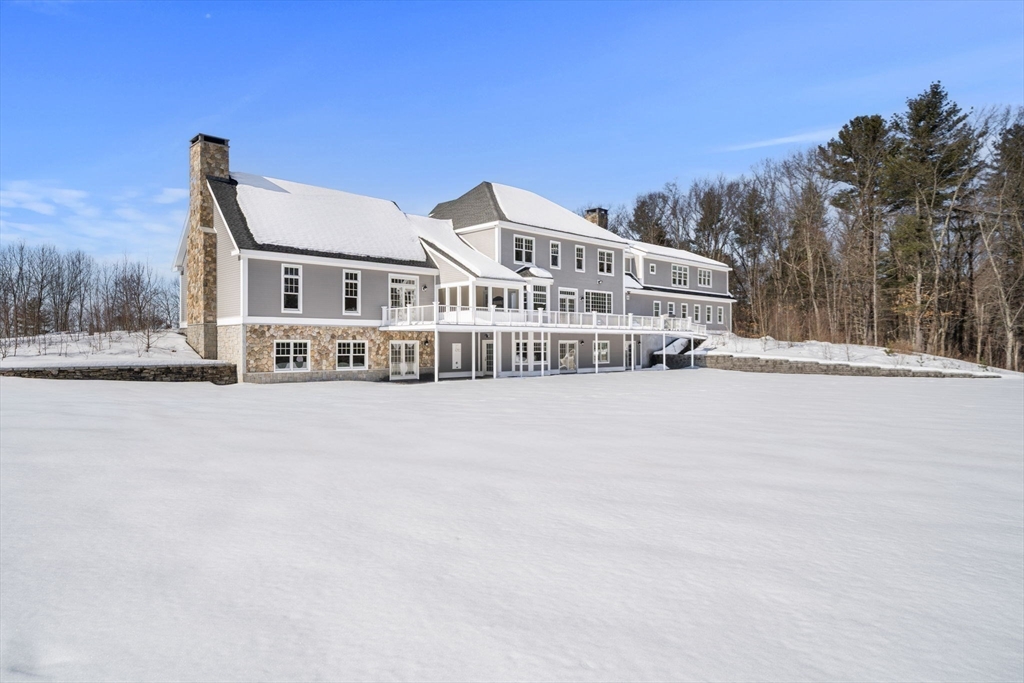 72 Dale Lane Groton, MA 01450 - Photo 5 of 42 a view of house with yard and trees in the background