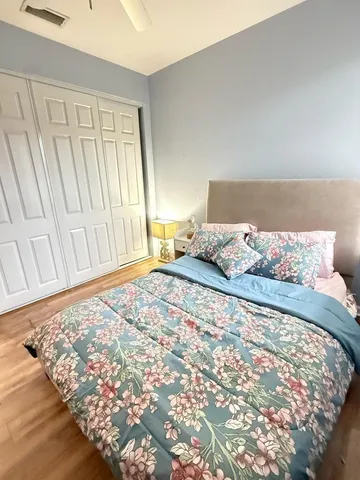 a view of a room with wooden floor and closet