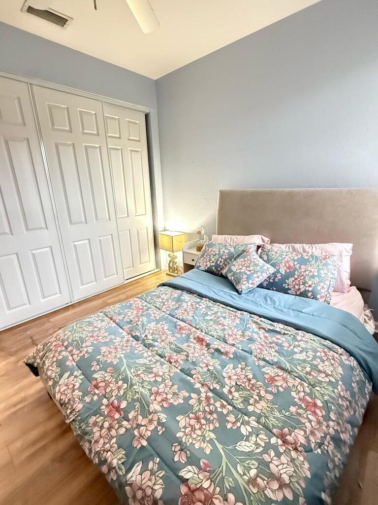 2891 Cedar Dunes Drive Port St. Lucie, FL 34953 - Photo 16 of 25 a bedroom with a bed and a window