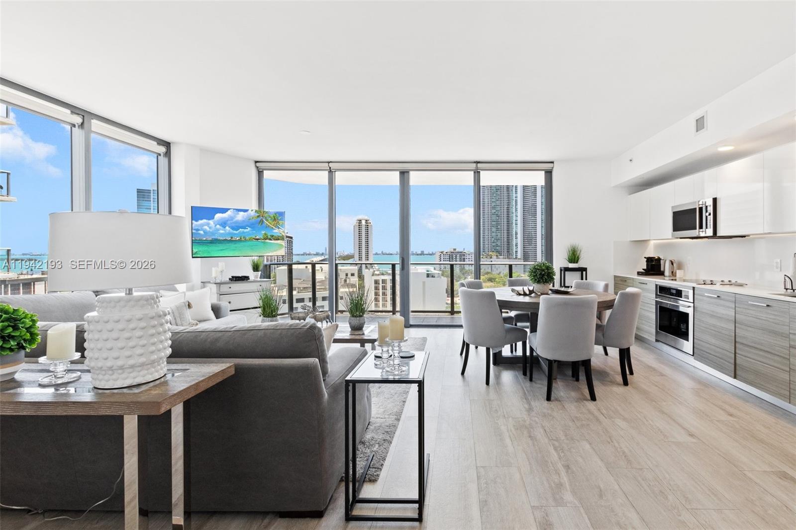 a view of a dining room with furniture and wooden floor