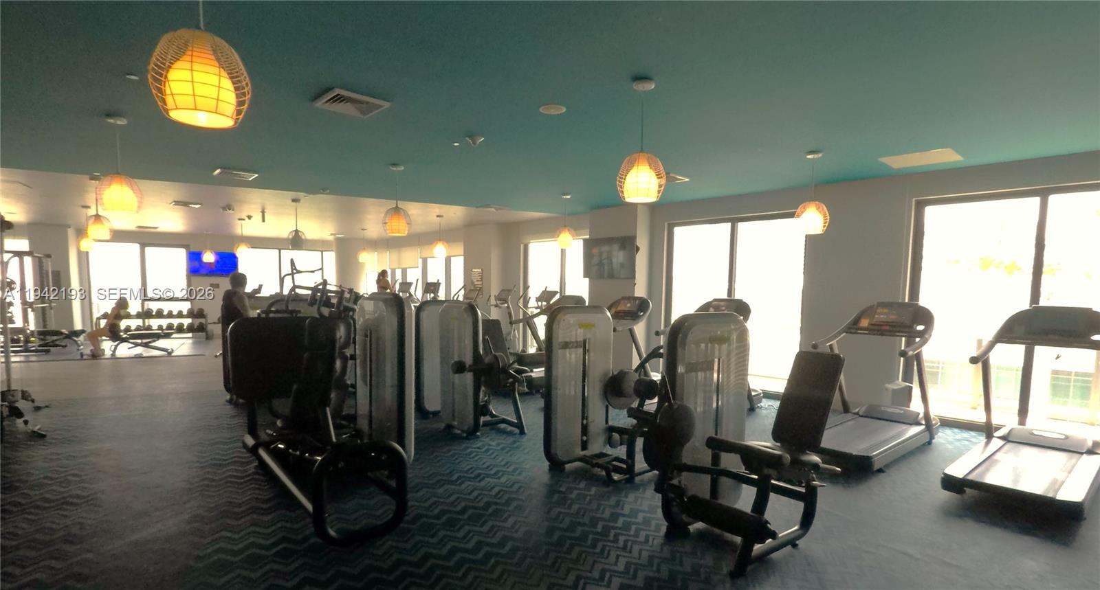 121 Northeast 34th Street, Unit 1008 Miami, FL 33137 - Photo 41 of 52 a view of a room with gym equipment