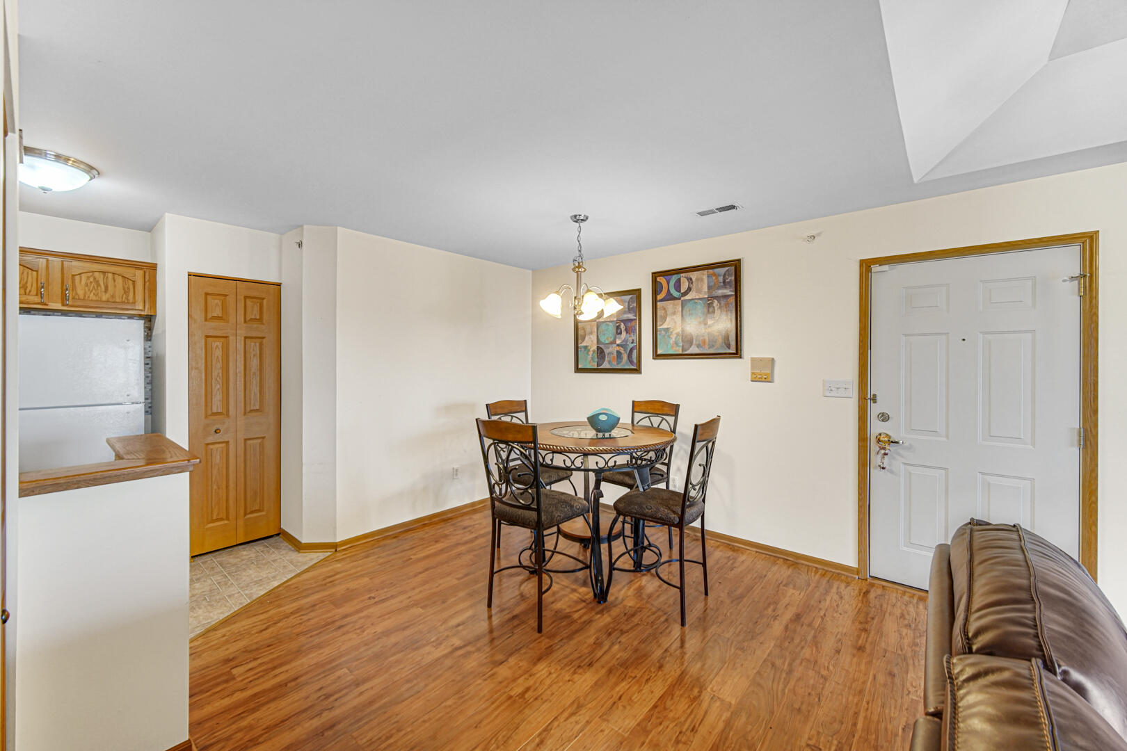 2007 West 75th Place, Unit 31 Merrillville, IN 46410 - Photo 11 of 17 a view of a dining room with furniture and wooden floor