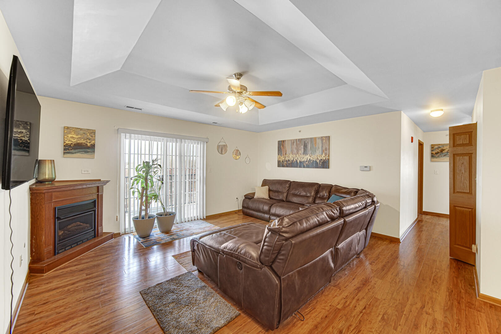 2007 West 75th Place, Unit 31 Merrillville, IN 46410 - Photo 13 of 17 a living room with furniture fireplace and flat screen tv