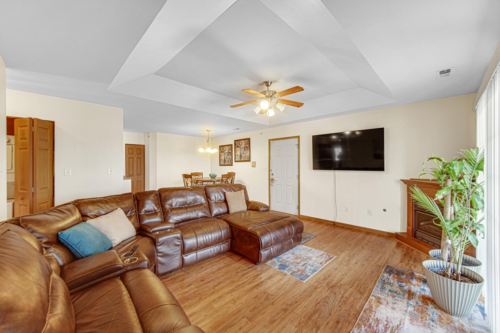 2007 West 75th Place, Unit 31 Merrillville, IN 46410 - Photo 14 of 17 a living room with furniture and a flat screen tv