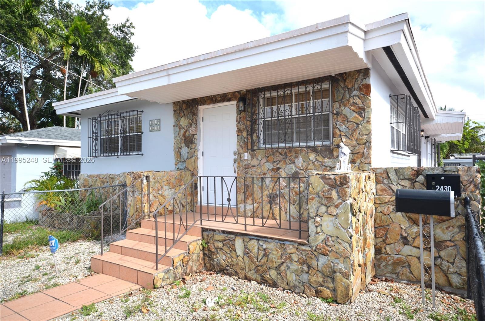 a front view of a house with a porch