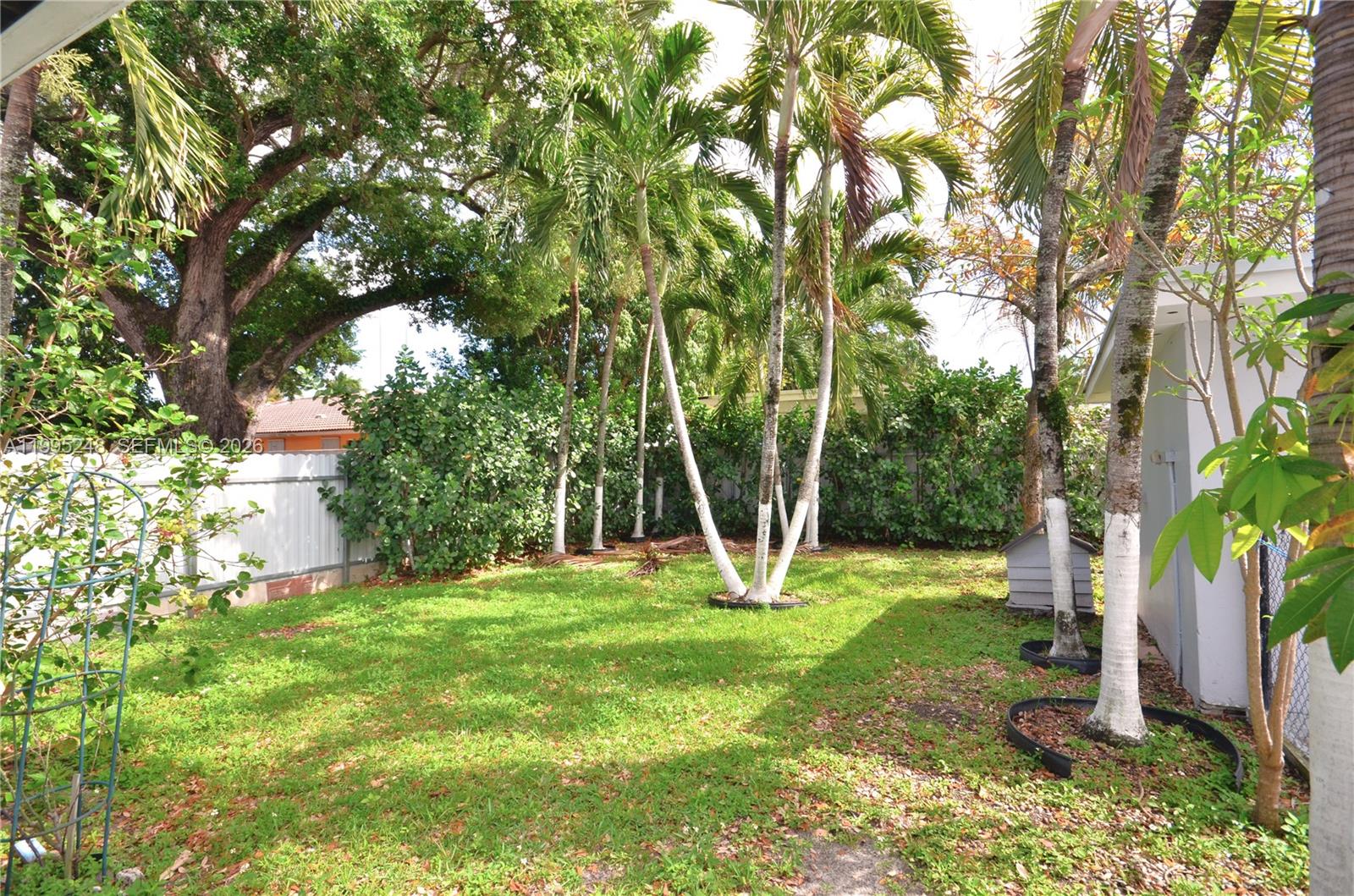 2430 Southwest 16th Street, Unit 2430 Miami, FL 33145 - Photo 16 of 18 a view of a backyard with a small cabin