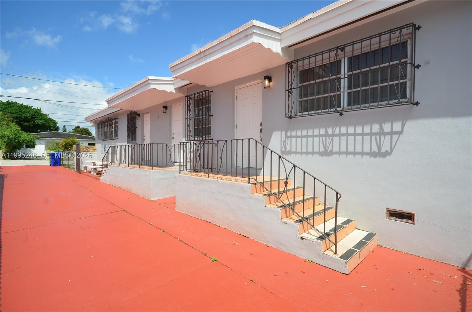 2430 Southwest 16th Street, Unit 2430 Miami, FL 33145 - Photo 17 of 18 a view of a house with a wooden bench