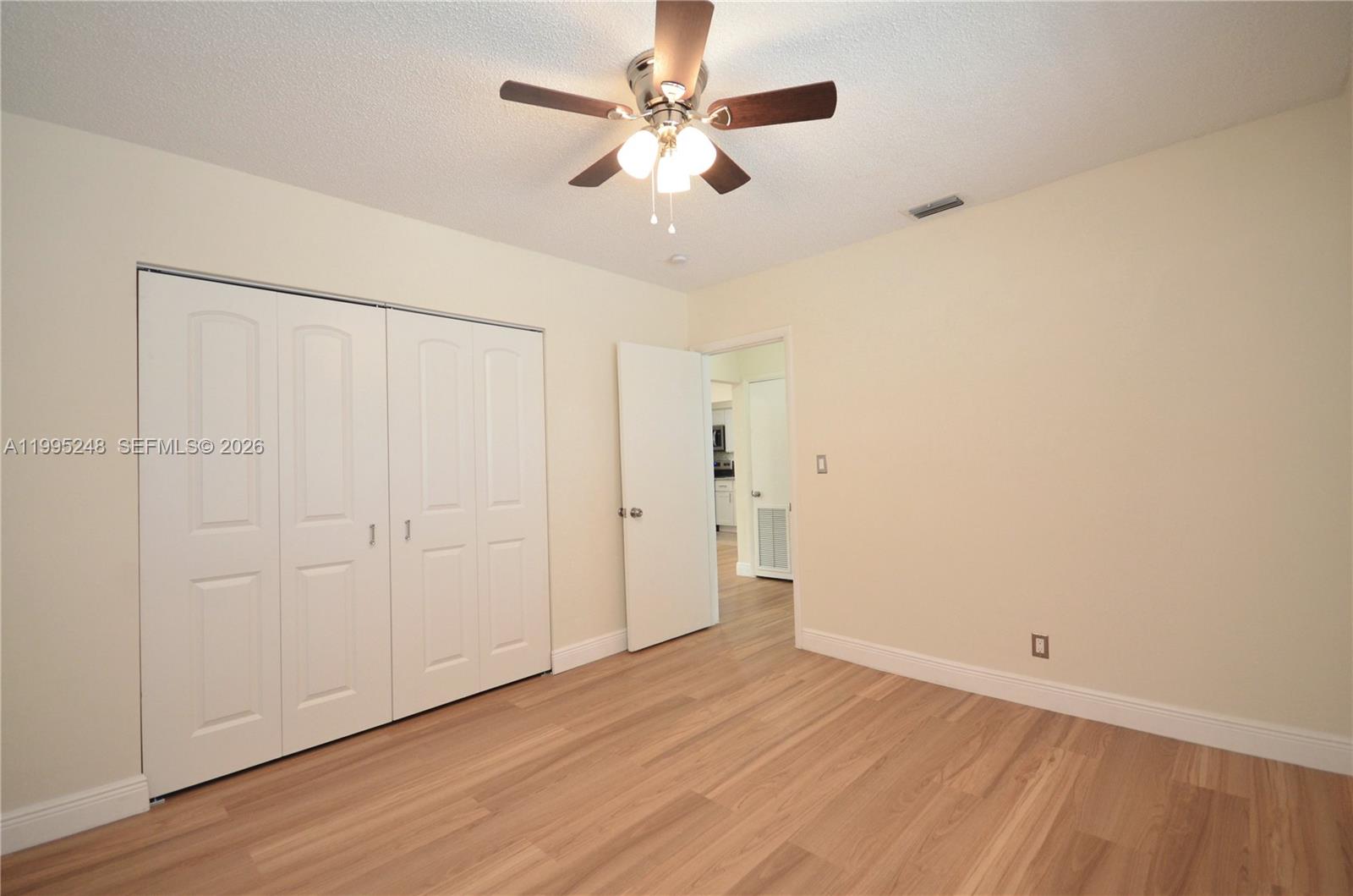 2430 Southwest 16th Street, Unit 2430 Miami, FL 33145 - Photo 10 of 18 wooden floor in an empty room