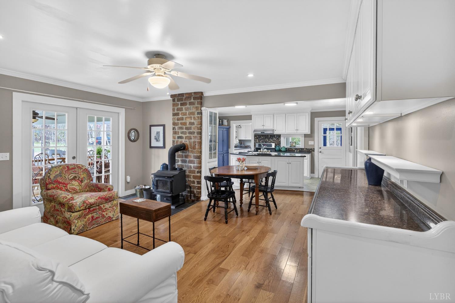 3805 Whipping Creek Road Gladys, VA 24554 - Photo 19 of 96 a dining room with furniture a chandelier and wooden floor