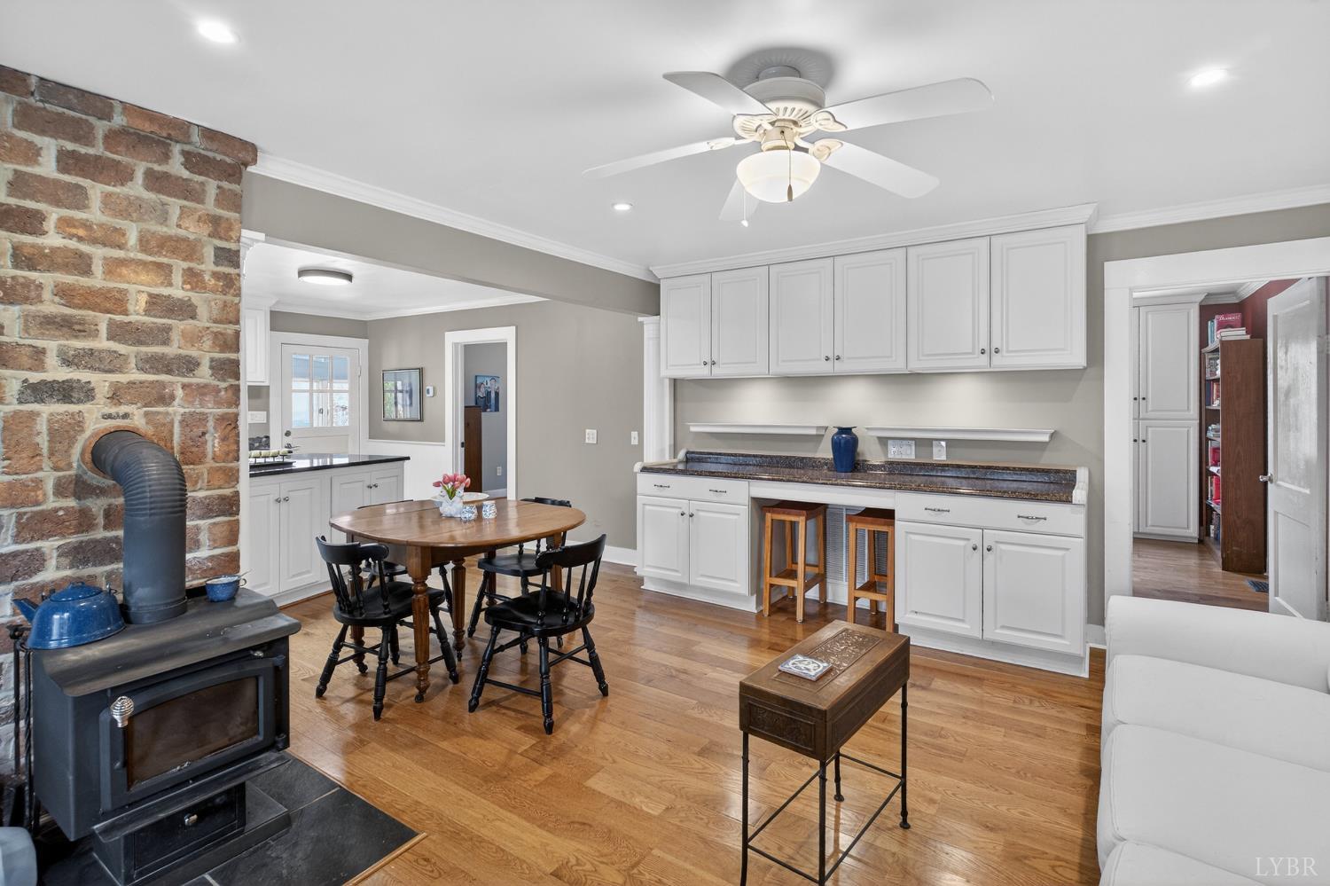 3805 Whipping Creek Road Gladys, VA 24554 - Photo 21 of 96 a kitchen with granite countertop a stove a sink a dining table and chairs