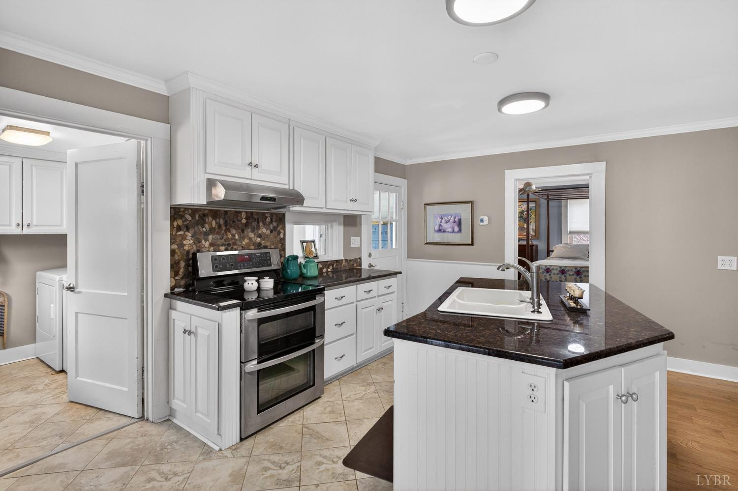 3805 Whipping Creek Road Gladys, VA 24554 - Photo 24 of 96 a kitchen with granite countertop a sink stove and refrigerator